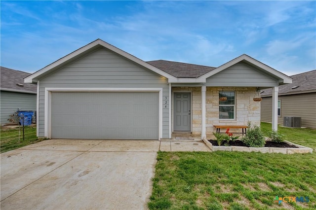 single story home with central air condition unit, stone siding, concrete driveway, a garage, and a front lawn