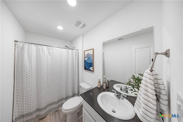 full bath featuring toilet, visible vents, shower / bathtub combination with curtain, vanity, and recessed lighting