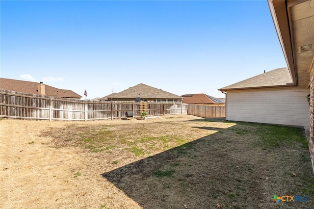 view of yard featuring a fenced backyard