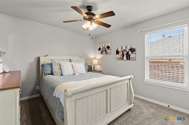 carpeted bedroom featuring baseboards and a ceiling fan