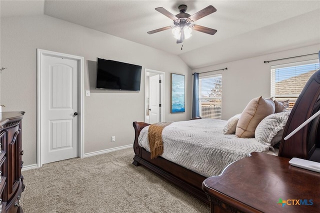 carpeted bedroom with lofted ceiling, multiple windows, and baseboards