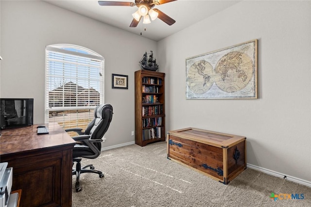 office with baseboards, light carpet, and ceiling fan