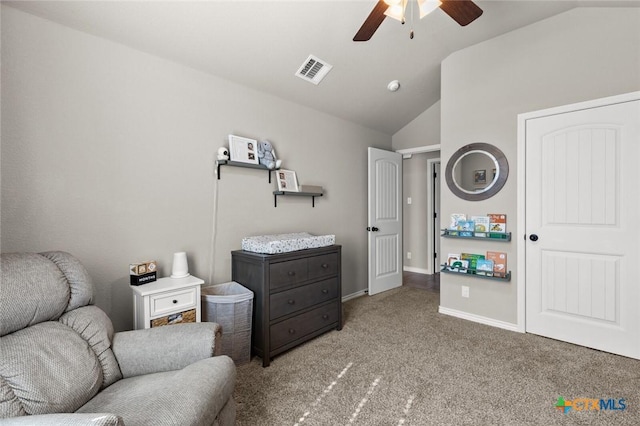 living area featuring visible vents, baseboards, ceiling fan, lofted ceiling, and carpet flooring