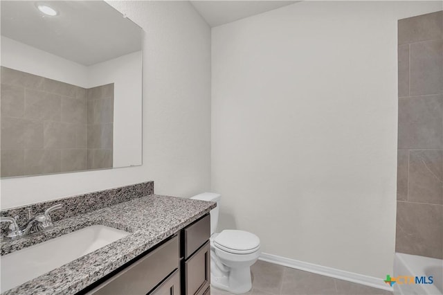 kitchen with a kitchen island with sink, a healthy amount of sunlight, sink, and dark stone countertops