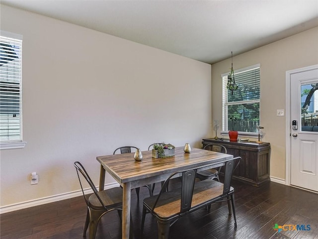 164 Flexus Ln, Liberty Hill, TX 78642 - dining space with dark wood-style floors and baseboards