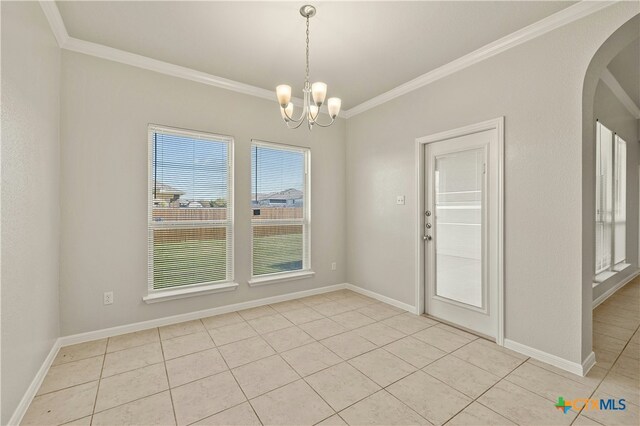 6109 Worthing Dr, Temple, TX 76502 - unfurnished dining area featuring crown molding, light tile patterned flooring, a chandelier, arched walkways, and baseboards
