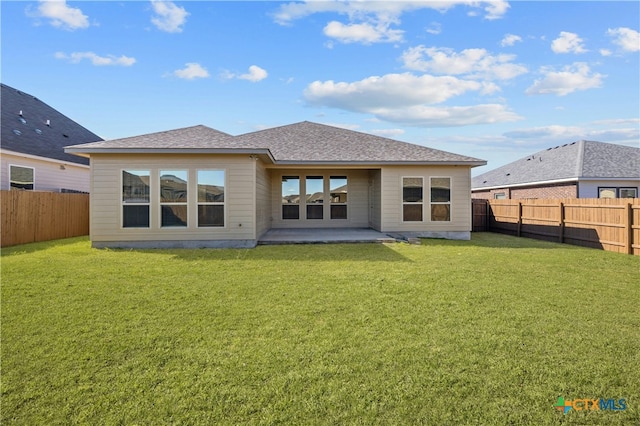 back of property featuring a yard and a patio area