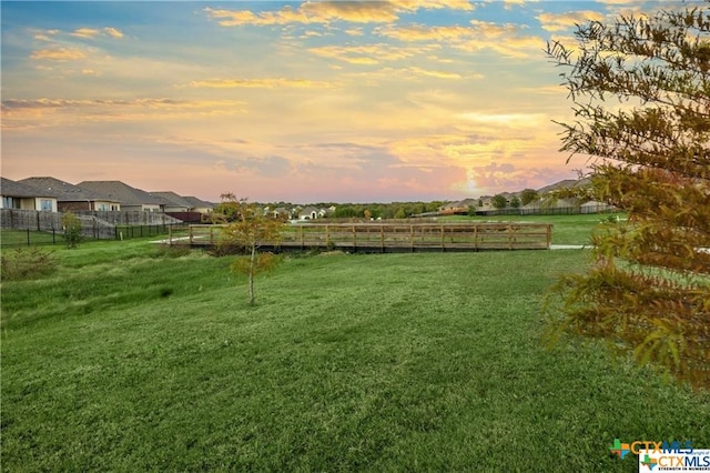 surrounding community with a yard and a rural view