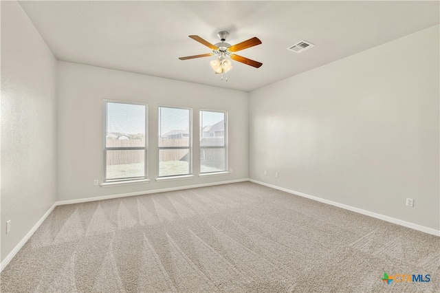 carpeted empty room with ceiling fan