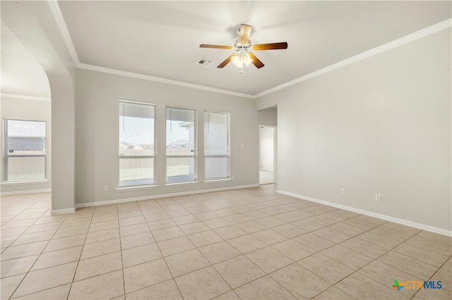 empty room featuring light tile patterned floors, ceiling fan, and crown molding