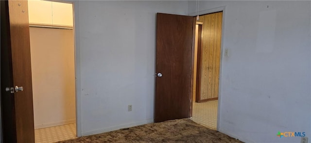 unfurnished bedroom with a closet