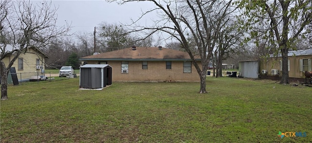 back of house with a lawn