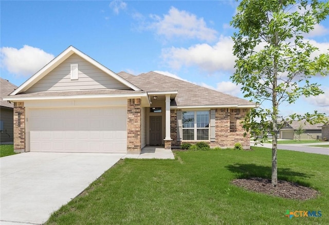 view of front of property featuring an attached garage, a front lawn, concrete driveway, and brick siding