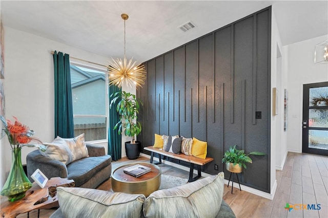 1620 Craftsman, New Braunfels, TX 78132 - living area with a chandelier, light wood finished floors, and plenty of natural light