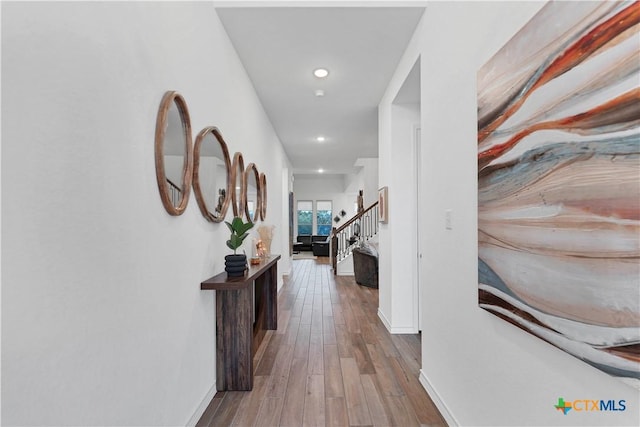 1620 Craftsman, New Braunfels, TX 78132 - hallway with wood finished floors, recessed lighting, and stairway