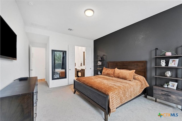 1620 Craftsman, New Braunfels, TX 78132 - bedroom with light carpet and connected bathroom