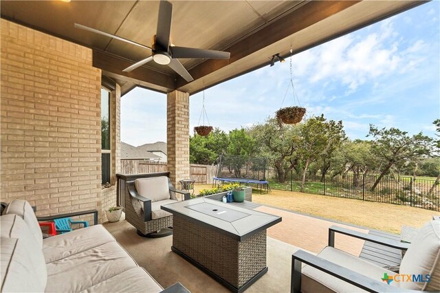 1620 Craftsman, New Braunfels, TX 78132 - fenced backyard featuring a trampoline, an outdoor hangout area, ceiling fan, and a patio area