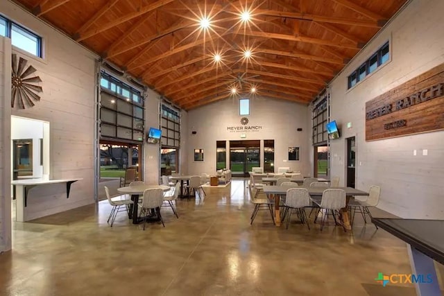 1620 Craftsman, New Braunfels, TX 78132 - dining area with high vaulted ceiling, concrete flooring, and wood ceiling
