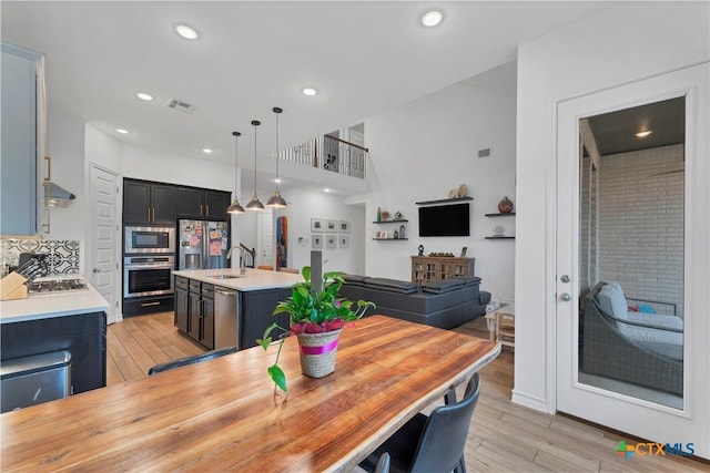1620 Craftsman, New Braunfels, TX 78132 - dining room with light wood-style floors and recessed lighting