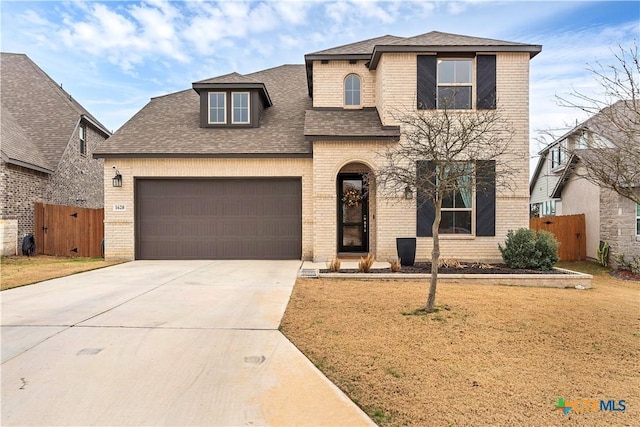 1620 Craftsman, New Braunfels, TX 78132 - view of front of home with brick siding, an attached garage, a shingled roof, and driveway