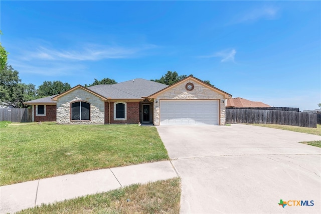 ranch-style home featuring a front lawn and a garage