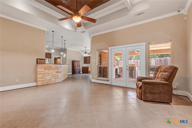 living room with french doors, a towering ceiling, ceiling fan, and light tile patterned flooring