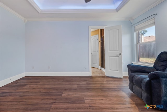 living area featuring wood-type flooring and ornamental molding