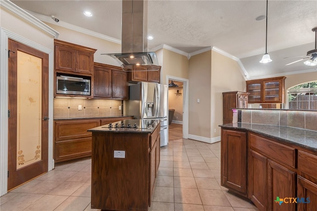 kitchen with island exhaust hood, a center island, stainless steel appliances, and backsplash