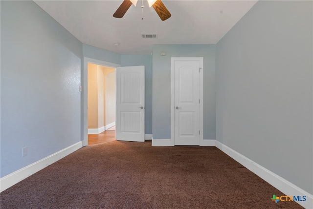 unfurnished bedroom featuring ceiling fan and carpet floors