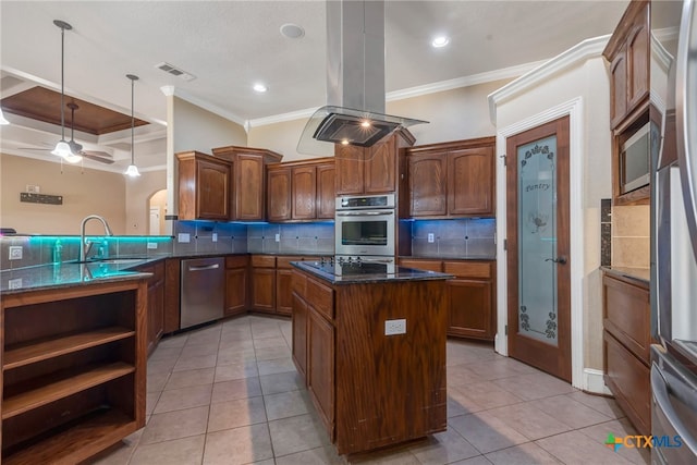 kitchen with crown molding, decorative light fixtures, island range hood, kitchen peninsula, and stainless steel appliances