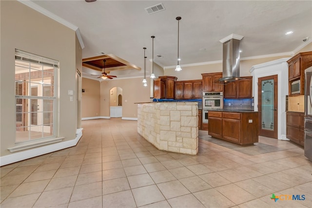 kitchen featuring a center island, crown molding, pendant lighting, light tile patterned flooring, and appliances with stainless steel finishes