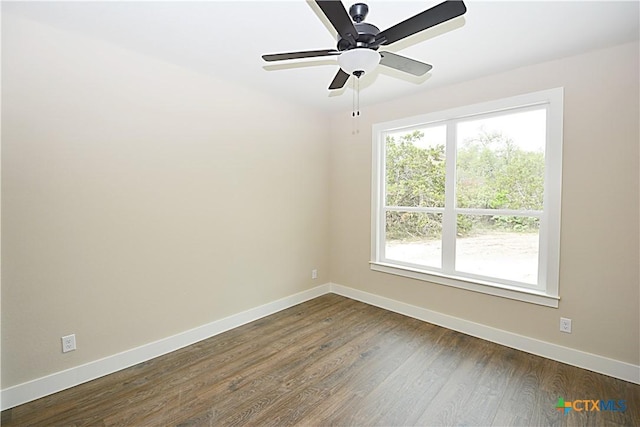 1560 Yaupon Dr, Fischer, TX 78623 - unfurnished room with baseboards, dark wood-type flooring, and ceiling fan