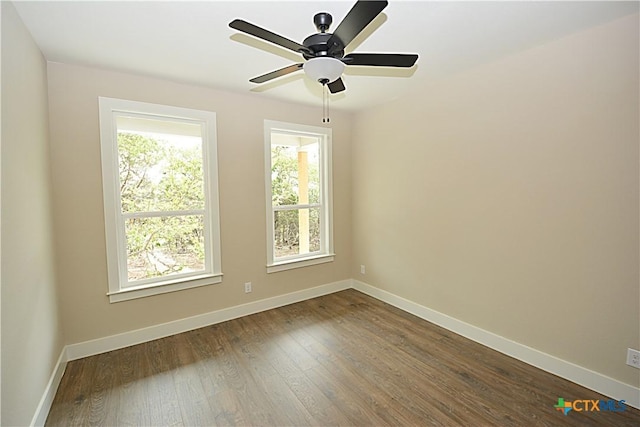 1560 Yaupon Dr, Fischer, TX 78623 - spare room with ceiling fan, baseboards, and dark wood-type flooring