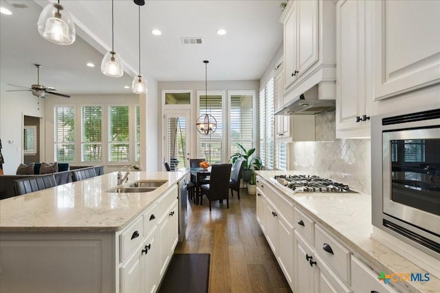 kitchen with visible vents, recessed lighting, a sink, dark wood finished floors, and appliances with stainless steel finishes