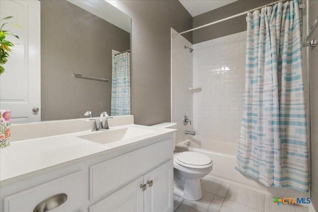 bathroom featuring vanity, tile patterned floors, shower / bath combo with shower curtain, and toilet