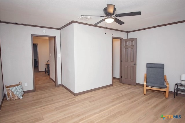 1317 N 10th St, Temple, TX 76501 - empty room with light wood-style floors, ornamental molding, a ceiling fan, and baseboards