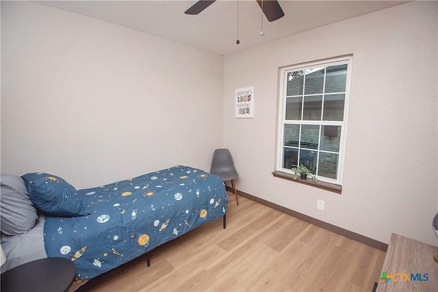 1317 N 10th St, Temple, TX 76501 - bedroom with wood finished floors, baseboards, and a ceiling fan