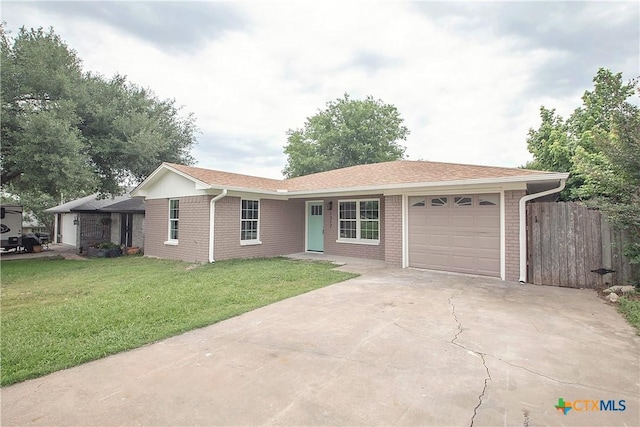 1317 N 10th St, Temple, TX 76501 - single story home with a garage, concrete driveway, and brick siding