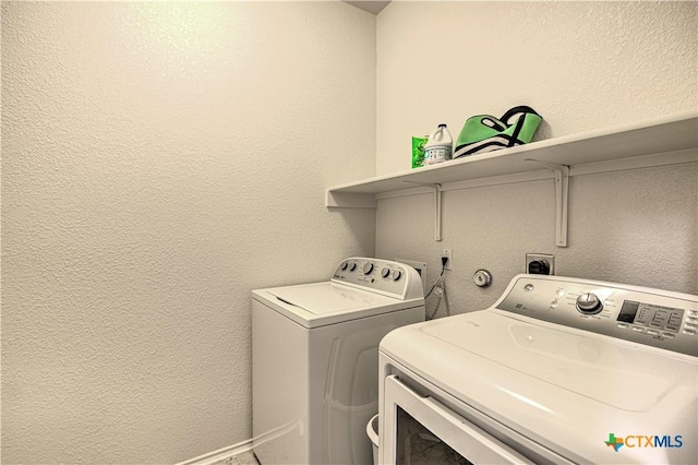 9006 Single Bend Trl, Temple, TX 76502 - washroom with independent washer and dryer and a textured wall