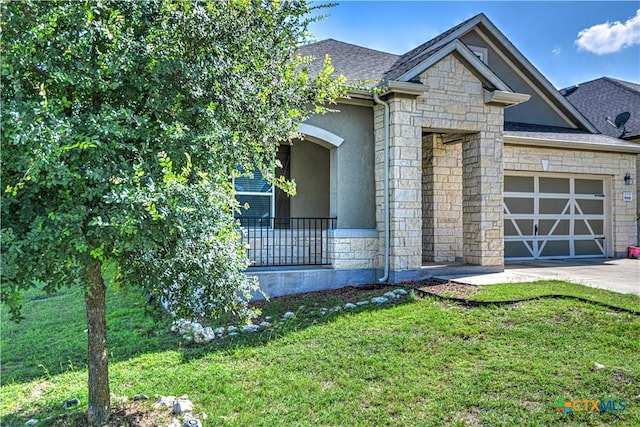9006 Single Bend Trl, Temple, TX 76502 - view of front of home featuring stone siding, an attached garage, stucco siding, concrete driveway, and a front yard