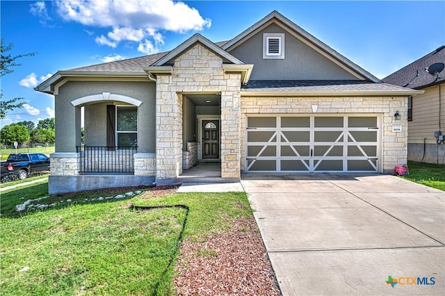 9006 Single Bend Trl, Temple, TX 76502 - view of front of home with stone siding, stucco siding, an attached garage, and covered porch