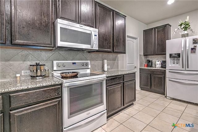 9006 Single Bend Trl, Temple, TX 76502 - kitchen featuring white range with electric stovetop, stainless steel refrigerator with ice dispenser, light tile patterned floors, tasteful backsplash, and dark brown cabinets