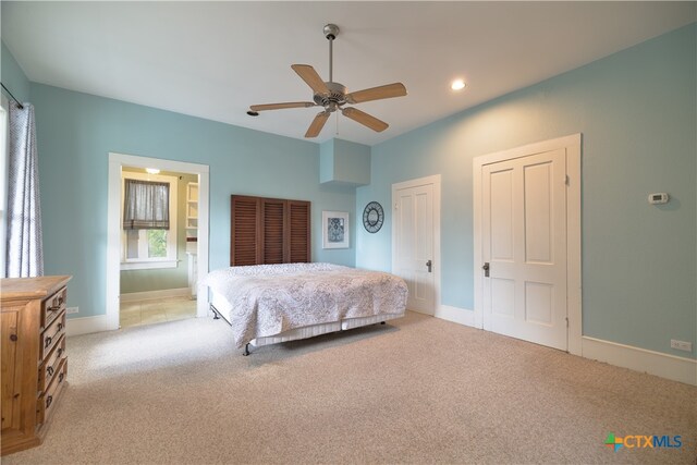 carpeted bedroom featuring ceiling fan