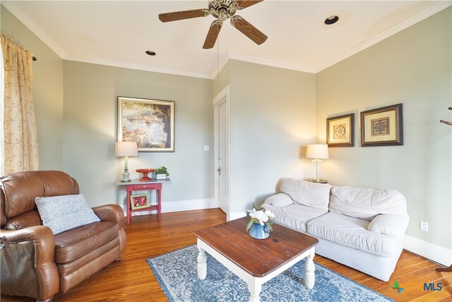 living room with ceiling fan, wood-type flooring, and crown molding