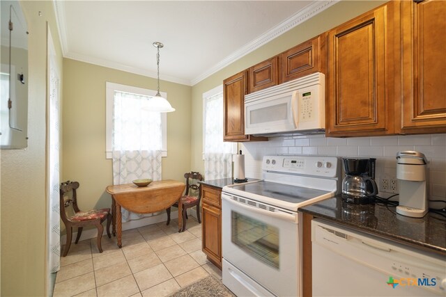 kitchen featuring light tile patterned flooring, ornamental molding, pendant lighting, decorative backsplash, and white appliances