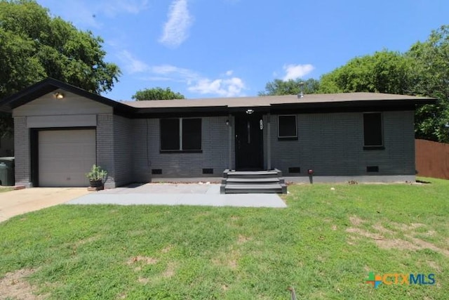 single story home featuring a front yard and a garage