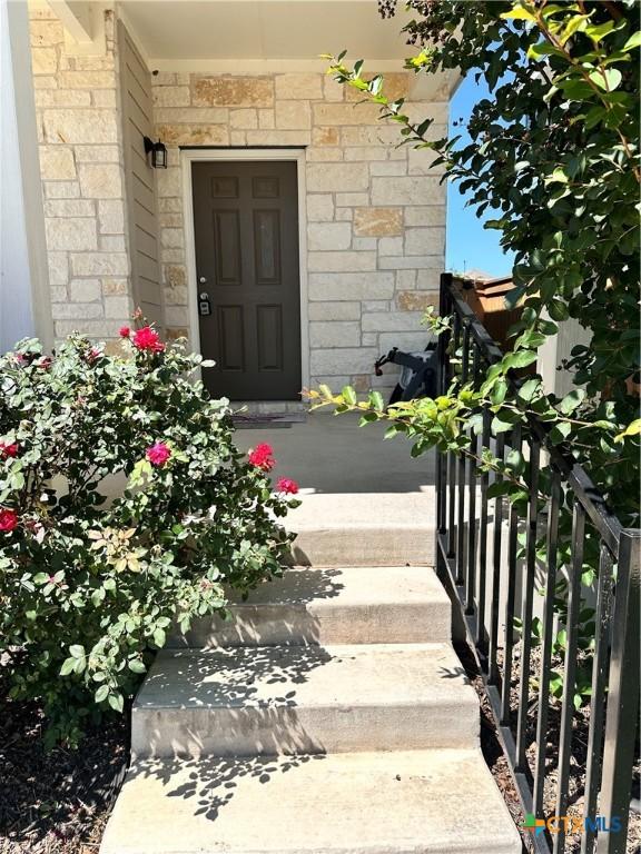 137 Rustic Glen Dr, San Marcos, TX 78666 - view of exterior entry featuring stone siding