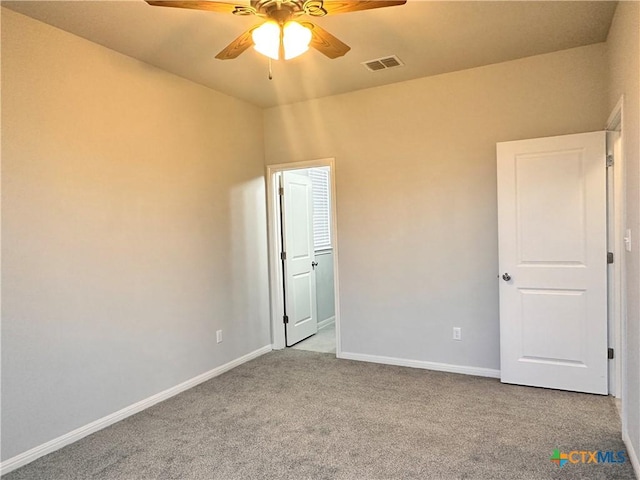 137 Rustic Glen Dr, San Marcos, TX 78666 - unfurnished bedroom featuring carpet flooring, baseboards, and ceiling fan