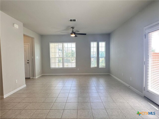 137 Rustic Glen Dr, San Marcos, TX 78666 - empty room with light tile patterned flooring, a ceiling fan, and baseboards