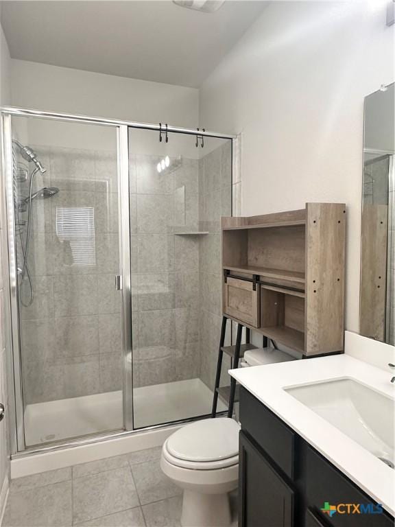 137 Rustic Glen Dr, San Marcos, TX 78666 - bathroom with a shower stall, tile patterned floors, toilet, and vanity
